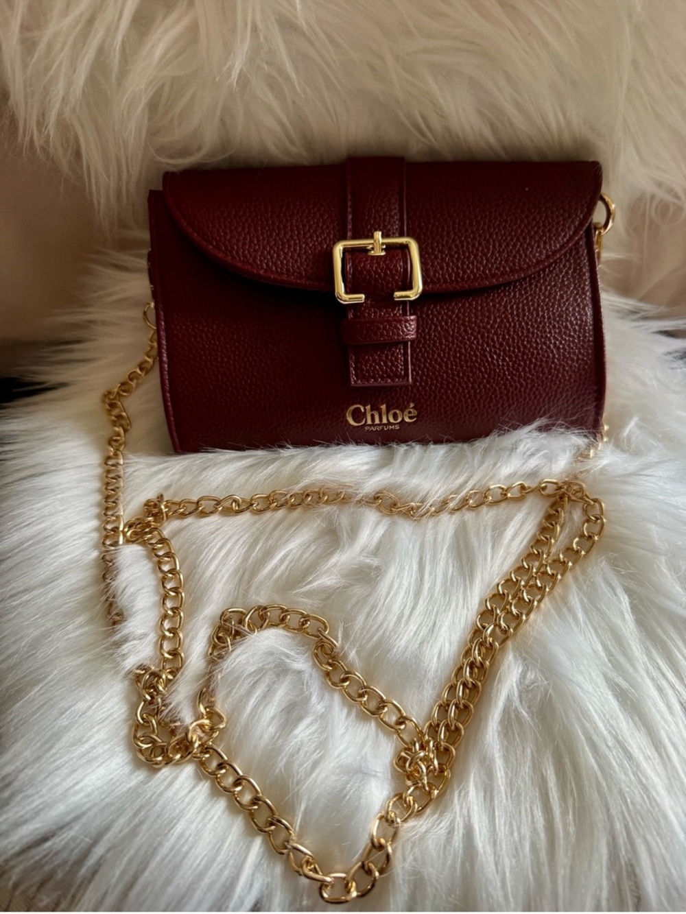 Chloé Parfums Burgundy Small clutch with Gold Buckle and pearl chain